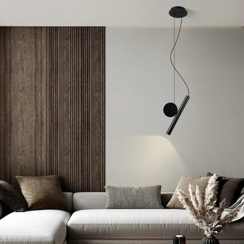 Modern black cylindrical led pendant lamp with sleek circular elements and curved cord for dining room decorbites adjustable led