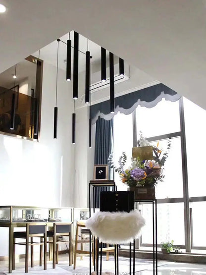 Modern black cylindrical led staircase chandelier suspension light featuring decorbites cylindrical led pendant lights