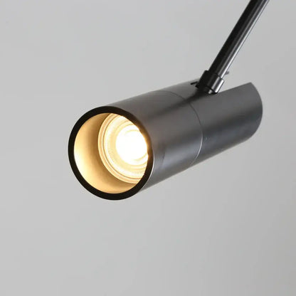 Modern black cylindrical pendant light with warm glowing bulb ideal as decorbites black chandelier bedroom spotlight