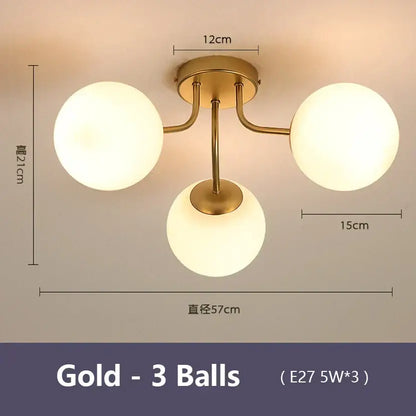 Modern black decorbites bubble glass led ceiling light with gold-colored fixture and three frosted globe bulbs for living room