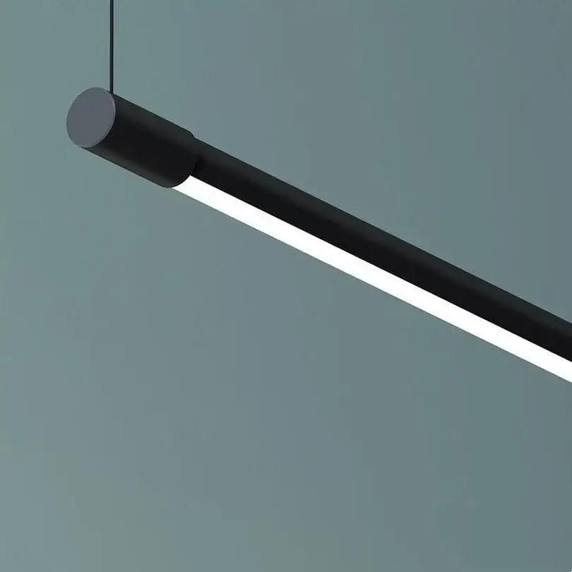 Modern black dimmable pendant light with sleek cylindrical design and illuminated led strip for dining room decorbites