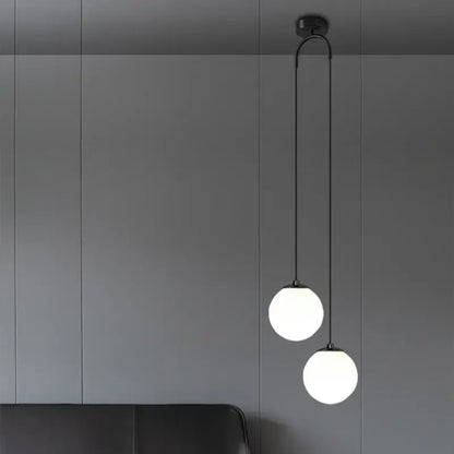 Modern black double glass ball pendant light with two frosted glass globes for bedroom ceiling illumination