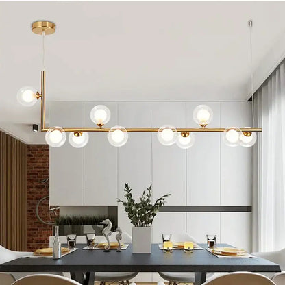 Modern black double glass lampshade chandelier with gold-toned pendant and clear glass globes for dining room lighting
