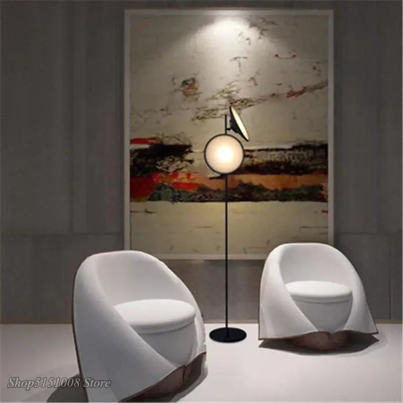 Modern black decorbites double horn radar floor lamp with circular glowing bulb and angular living room spotlight