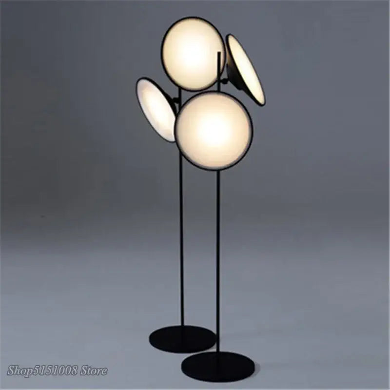 Modern black double horn radar floor lamp with four illuminated spherical and disc-shaped light fixtures for living room decorbites floor lamp