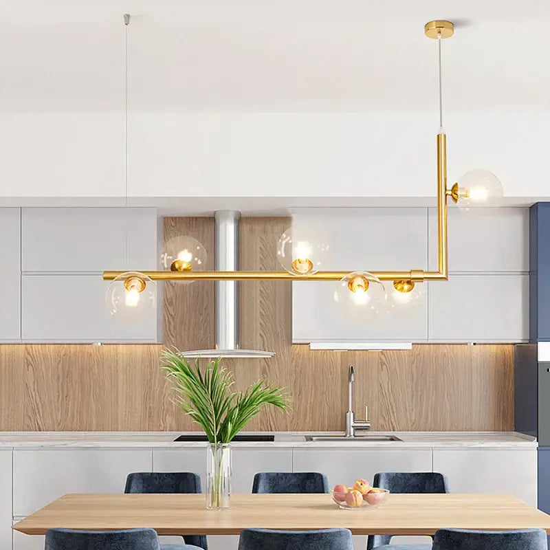 Modern gold-toned decorbites dual glass pendant light with clear glass globe bulbs for dining room ceiling decor
