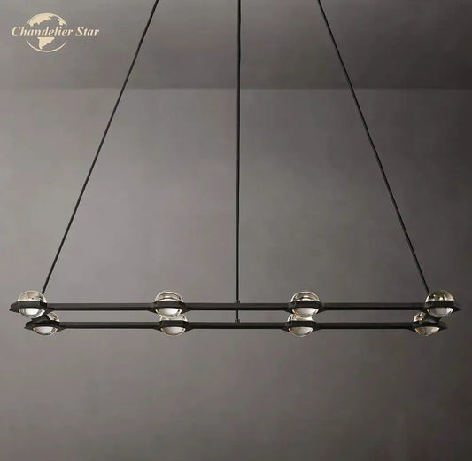 Modern black éclatant crystal chandelier with clear glass globe bulbs suspended by thin cords for living room use