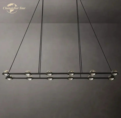 Modern black éclatant crystal chandelier with spherical glass globe lights suspended by thin cords for dining room use