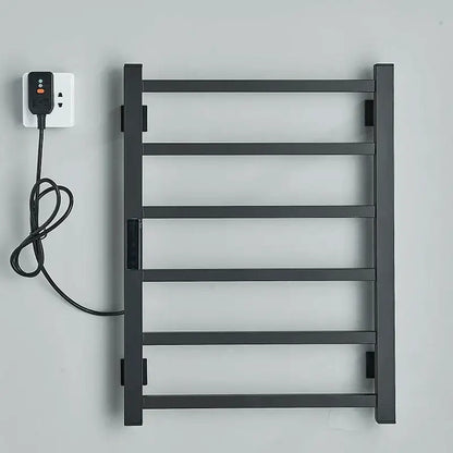 Modern black electric towel warmer with five bars and digital display plugged in for bathroom use as towel warmer
