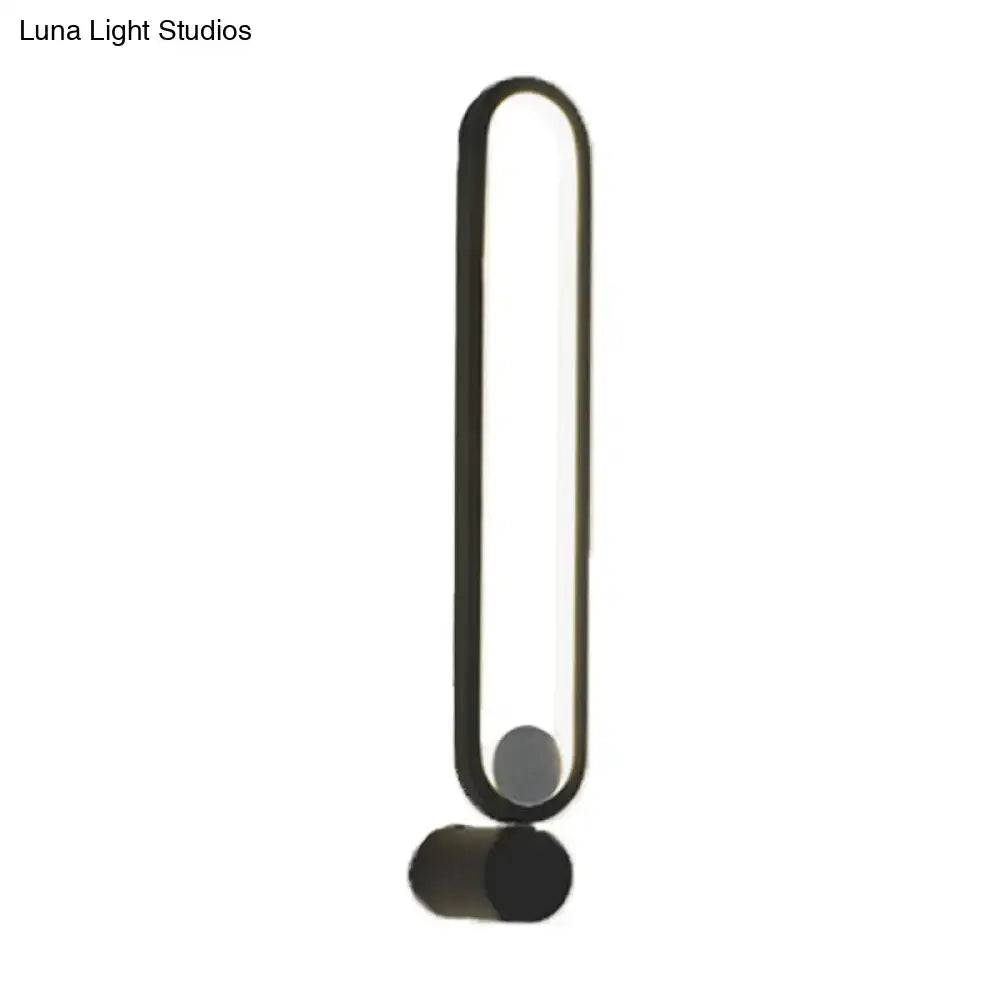 Modern black elliptical wall lamp with sleek elongated oval frame and cylindrical base for study room LED sconce 220v-240v maximum bulb wattage