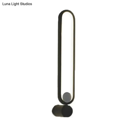 Modern black elliptical wall lamp with sleek elongated oval frame and cylindrical base for study room LED sconce 220v-240v maximum bulb wattage
