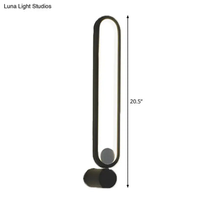 Modern black elliptical wall lamp with sleek oval frame and cylindrical base suitable for 220v-240v maximum bulb wattage