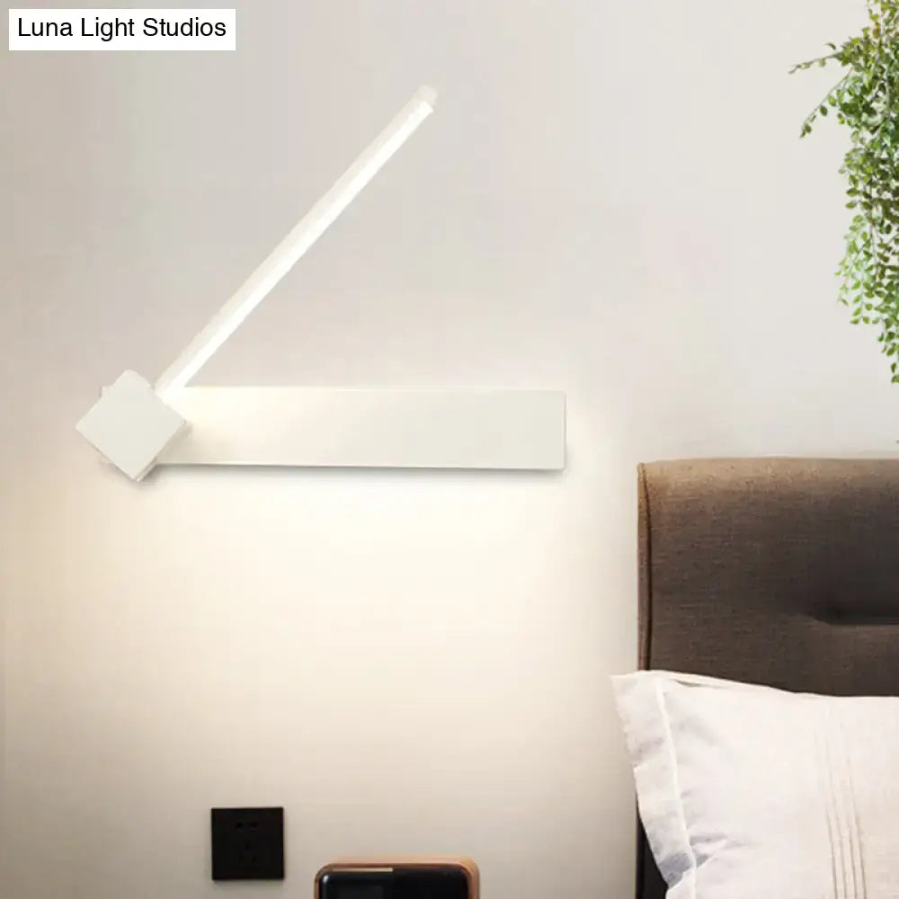Modern white wall-mounted lamp with sleek angular design and minimalist finish for bedroom lighting in black finish