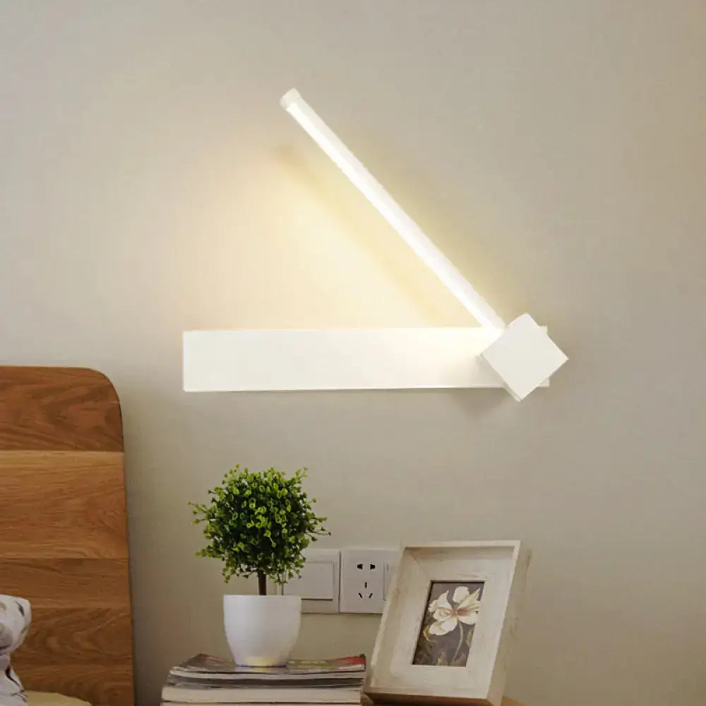 Modern black finish rotatable led wall sconce with sleek angular design and warm light for bedroom lighting