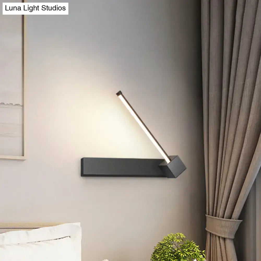Modern black finish rotatable led wall sconce with sleek angular design and warm white light for bedroom lighting