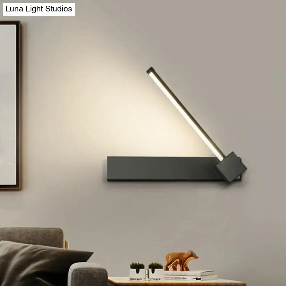 Modern black finish metal wall sconce with sleek angular design and adjustable led light bar for bedroom lighting