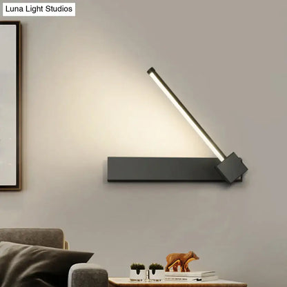 Modern black finish metal wall sconce with sleek angular design and adjustable led light bar for bedroom lighting