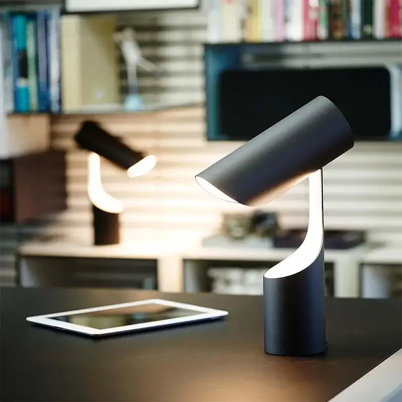 Modern black foldable desk lamp by decorbites with a sleek cylindrical design and curved base for study and bedroom use