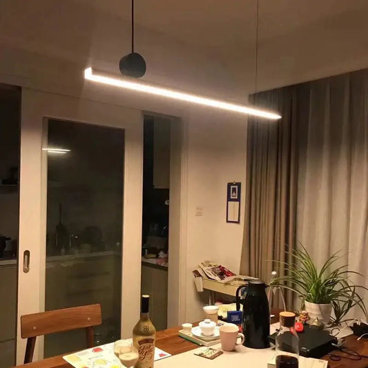 Modern black geometric copper pendant light with a matte black spherical top and rectangular led bar for dining room decorbites geometric copper pendant