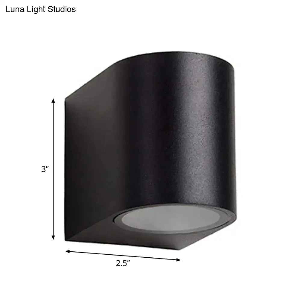 Modern black geometric led outdoor wall mount featuring a matte finish black cylindrical outdoor wall sconce 3 inch height