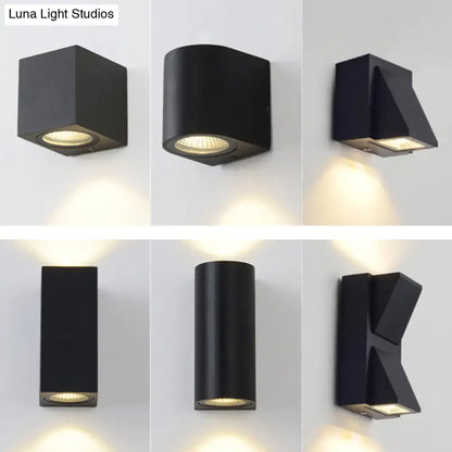 Modern black geometric led outdoor wall mount featuring sleek design with warm focused lighting for outdoor wall use