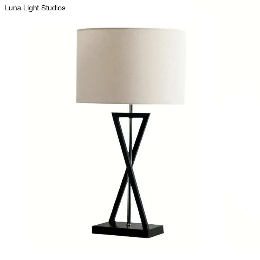 Black geometric drum nightstand lamp with cream fabric drum shade 1-light bedside table inch fixture by DecorBites