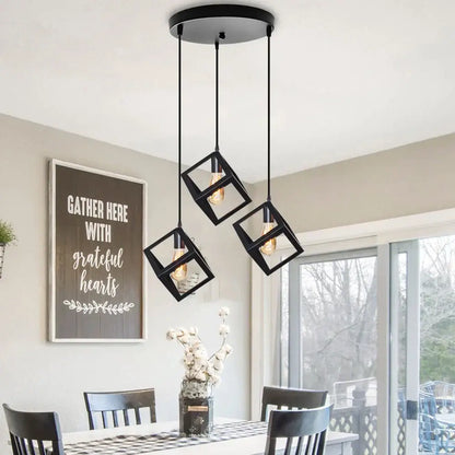Modern black geometric pendant light with three cube-shaped fixtures and exposed bulbs ideal for kitchen island decorbites black geometric