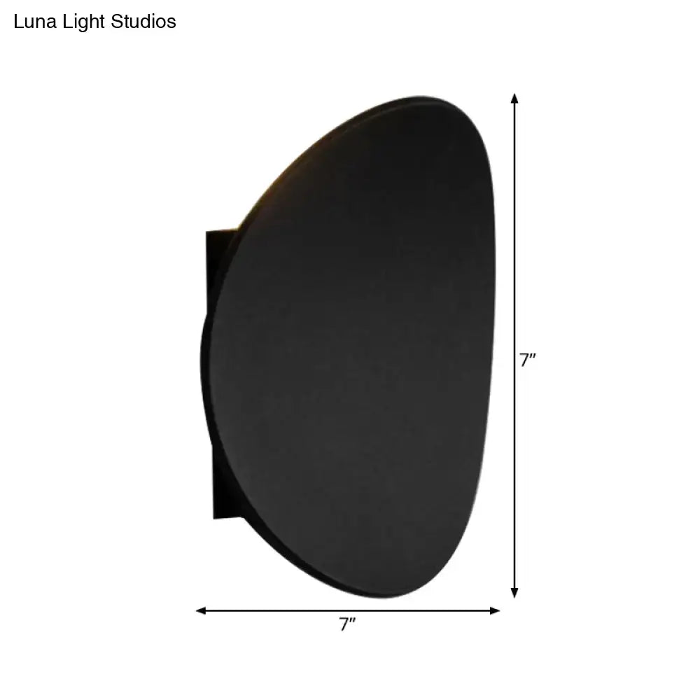 Modern black geometric wall lighting fixture with sleek oval matte finish ideal for bedroom wall lighting