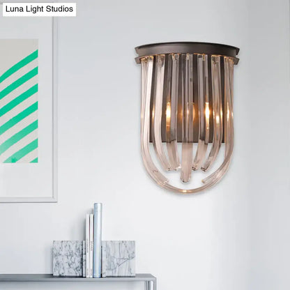 A modern semi oval wall light with a black finish featuring dark bronze frame and cascading translucent glass rods