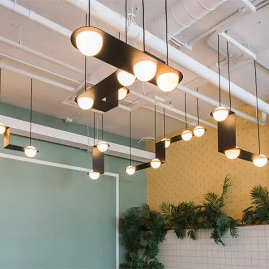 Modern black glass ball geometric chandelier with warm glowing spherical bulbs for kitchen decorbites glass ball pendant light