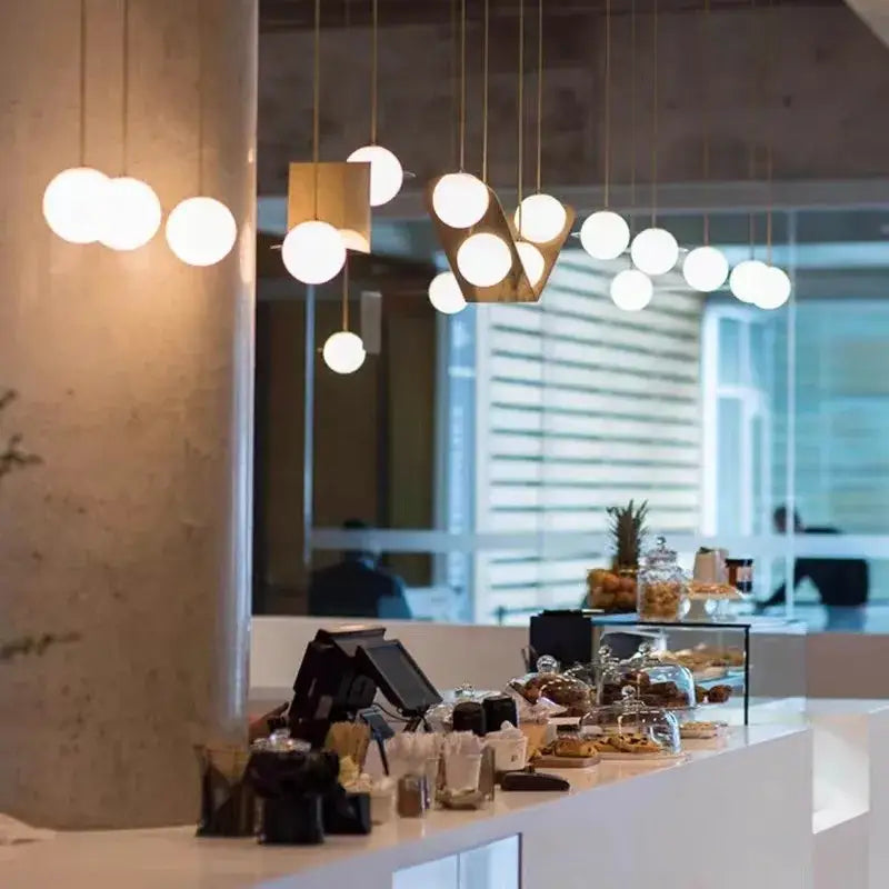 Modern black glass ball geometric chandelier with spherical white bulbs and gold frames for kitchen pendant light decorbites glass ball