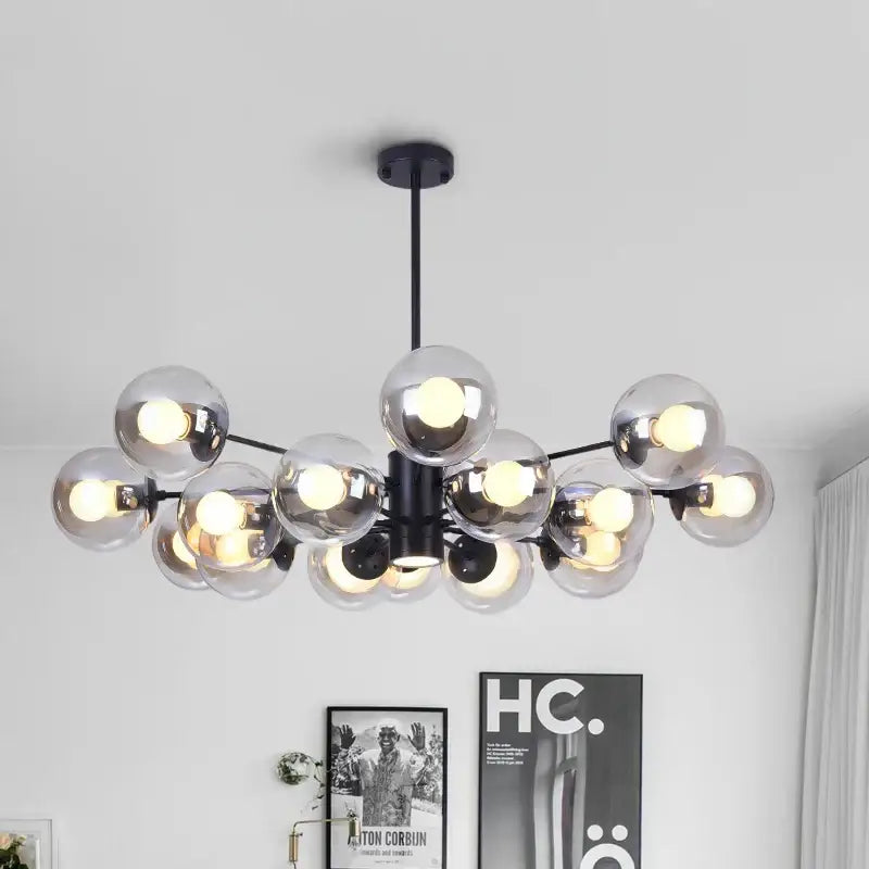 Modern black metal ball led chandelier with clear glass globe bulbs ideal for dining room decorbites glass ball lighting