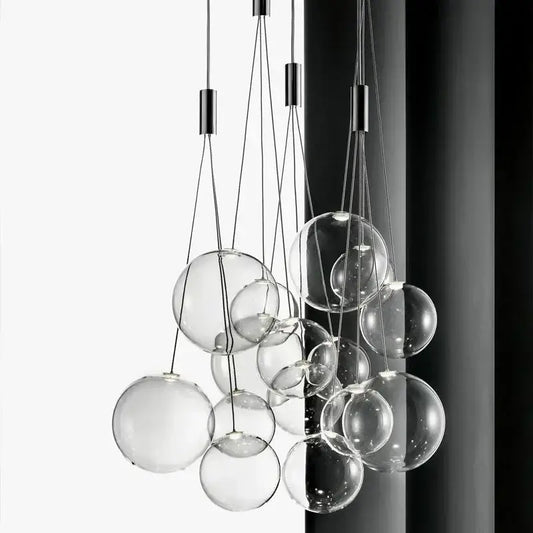 Modern black glass ball led pendant lamps featuring a clear glass sphere with sleek black metal hardware for kitchen decorbites pendant lamps