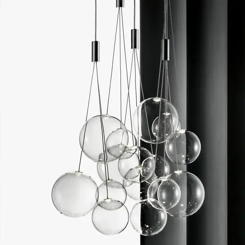 Modern black glass ball led pendant lamps featuring a clear glass sphere with sleek black metal hardware for kitchen decorbites pendant lamps