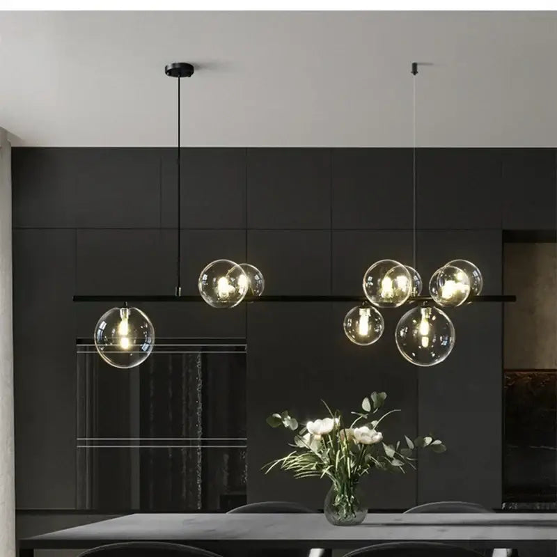 Modern black glass ball pendant light with black metal fixtures perfect for dining room decorbites glass ball pendant