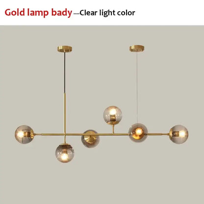 Modern black glass ball pendant light chandelier with gold-toned fixture and clear glass globe shades decorbites glass ball decor