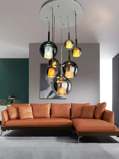 Modern black glass ball pendant lights with spherical glass pendant and warm amber lighting for kitchen island decorbites glass ball