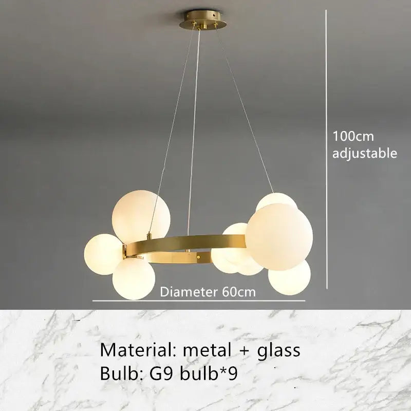 Modern gold-toned metal chandelier with frosted glass globe bulbs in a circular cluster glass bubble chandelier design