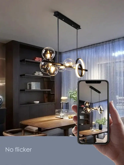 Modern black glass bubble chandelier with sleek metal frame and warm glowing bulbs for dining room ring light