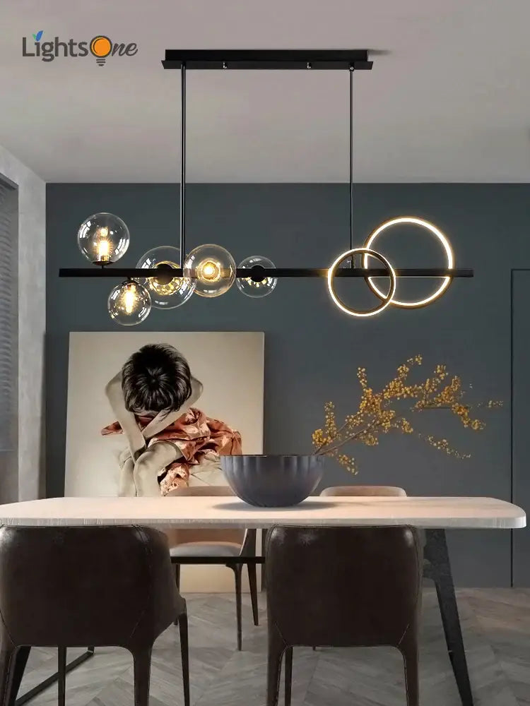 Modern black glass bubble chandelier with illuminated spheres and glowing rings for dining room lighting