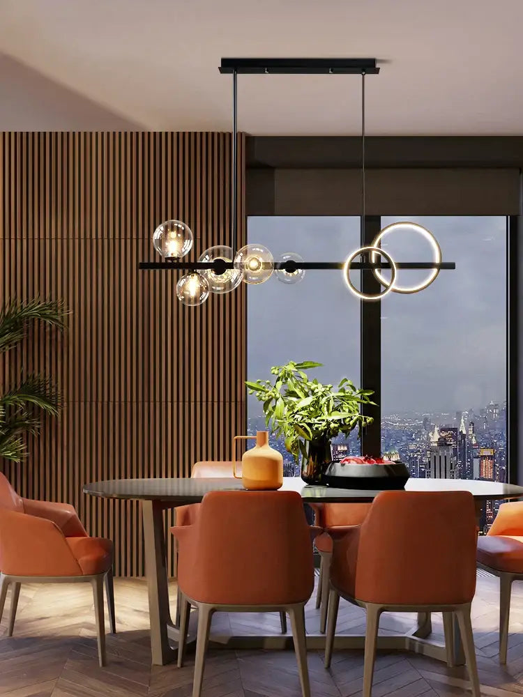 Modern black metal glass bubble chandelier with clear glass spheres and glowing circular rings for dining room use