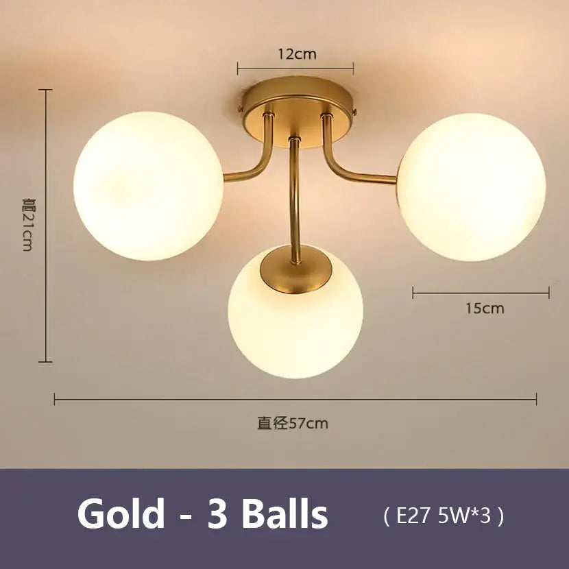 Gold-colored decorbites glass bubble ceiling light with three frosted glass globe bulbs for modern living room decor