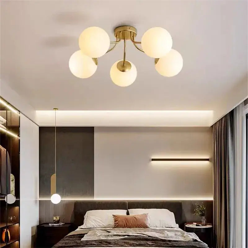 Modern black decorbites glass bubble led ceiling light with five gold-toned frosted glass globe shades for living room decor