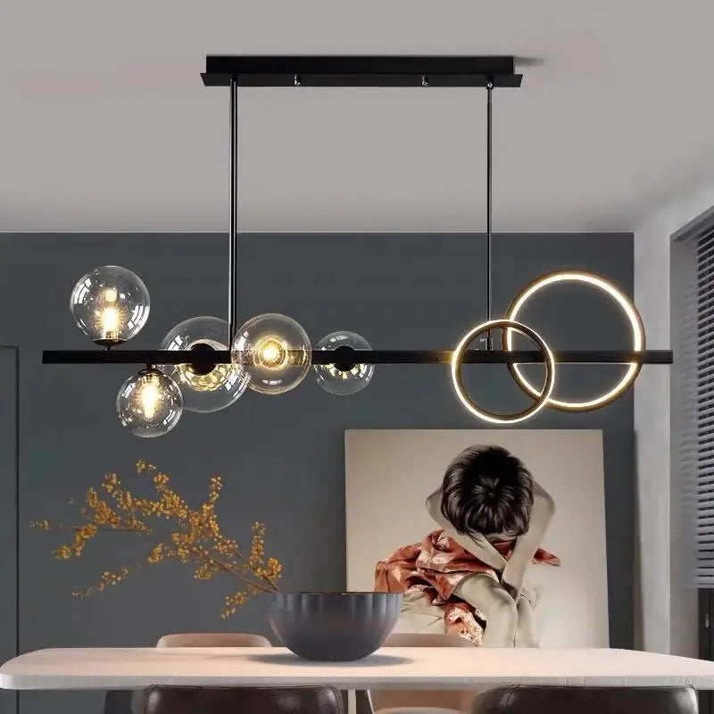 Modern black metal bubble led chandelier with clear glass globe bulbs and glowing gold rings for dining room decorbites glass bubble