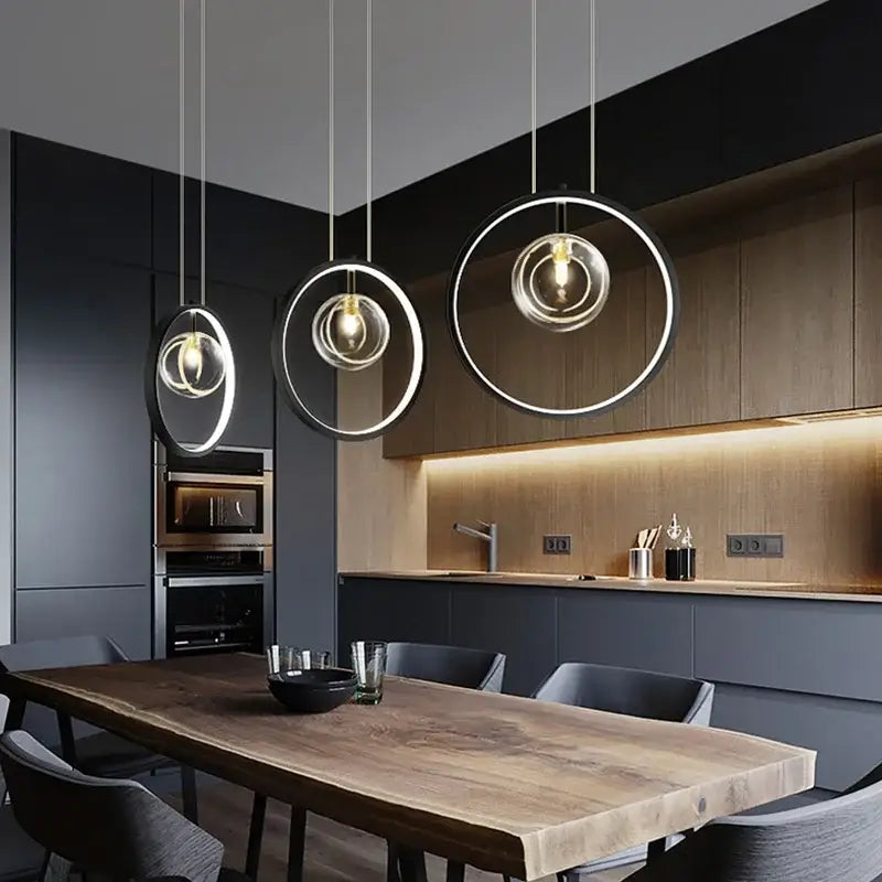 Modern black glass bubble led chandelier pendant light features minimalist black and clear glass rings with warm bulbs