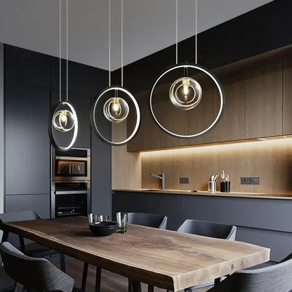 Modern black glass bubble led chandelier pendant light features minimalist black and clear glass rings with warm bulbs