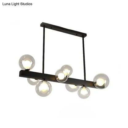 Modern black metal chandelier with clear glass globe bulbs designed for dining room and kitchen island lighting