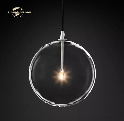 Modern black glass globe pendant light featuring a clear glass globe with silver rod and black cord for dining room decorbites glass globe