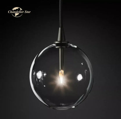 Modern black glass globe pendant light with clear glass globe and black metal fixture for dining room decorbites glass globe