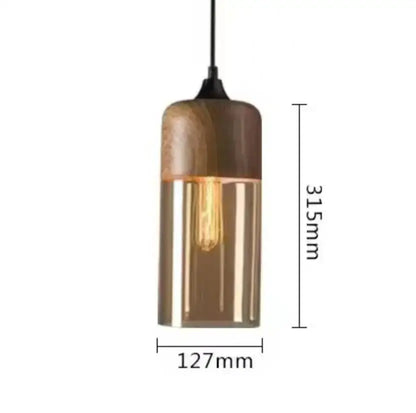 A modern pendant light with a cylindrical black glass body and wooden top for dining room decorbites black glass shades